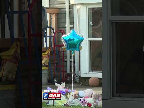 A memorial has been set up by the door of a Louisiana home where eight children were killed