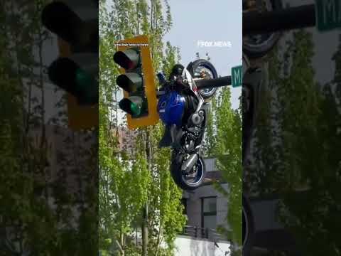 Motorcycle seen HANGING from traffic light after violent crash #shorts #us #News #viral