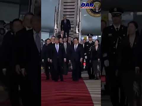 President Trump walks down the red carpet in Beijing