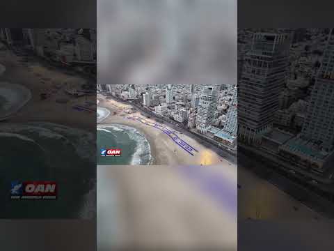 Beach display in Tel Aviv, Israel spells out “THANK YOU” beside a large sand art portrait of  Trump