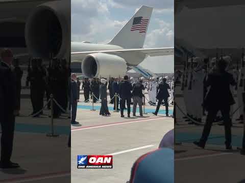 Trump is greeted by President Erdogan as he walks the tarmac of Etimesgut Air Base in Turkey