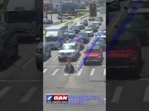 Driver dressed as Spider-Man jumped out of his car to help a man in a wheelchair cross intersection