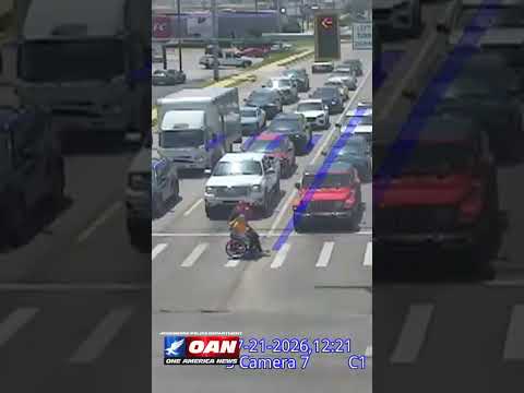 Driver dressed as Spider-Man jumped out of his car to help a man in a wheelchair cross intersection
