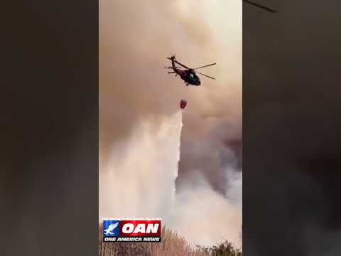 Nevada National Guard helicopter dropped water on the fast-moving Hawk Fire northwest of Reno