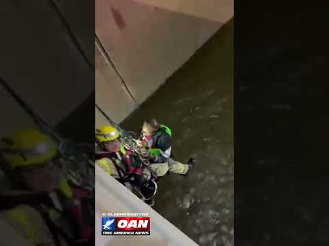 Firefighters rescued person who fell from bridge into drainage tunnel filled with fast-moving water